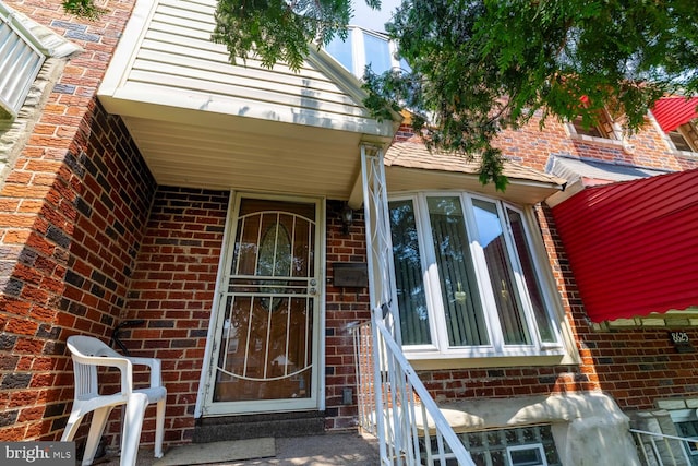 8627 Gilbert St, Philadelphia, PA 19150 - property entrance with brick siding