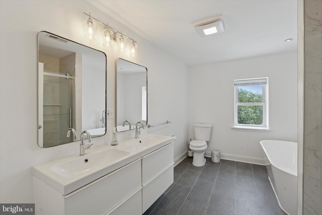 1537 S 2nd St, Philadelphia, PA 19147 - bathroom with a freestanding tub, baseboards, double vanity, a shower with door, and toilet