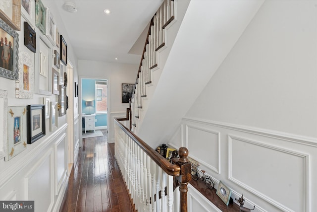 1537 S 2nd St, Philadelphia, PA 19147 - hallway with a decorative wall, a wainscoted wall, dark wood-type flooring, recessed lighting, and stairs