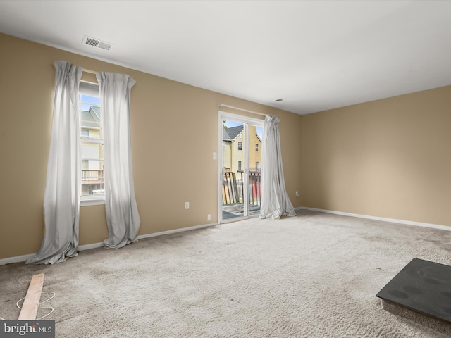 7677 E Arbory Ct Unit 231, Laurel, MD 20707 - spare room featuring plenty of natural light, carpet flooring, and baseboards