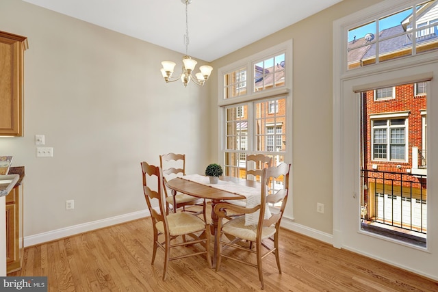 1650 Colonial Hills Dr, Mclean, VA 22102 - dining area featuring a chandelier, light wood-style floors, and healthy amount of natural light