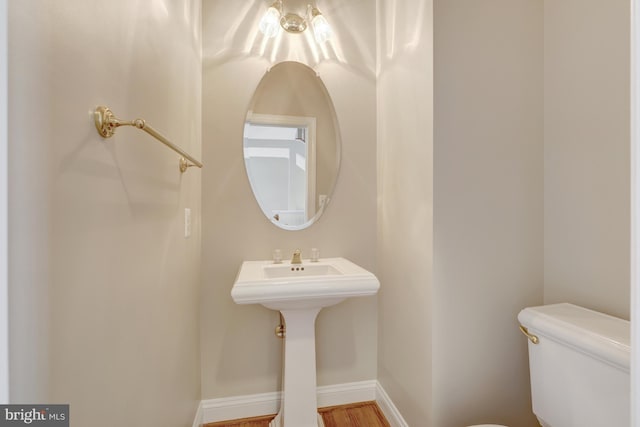 1650 Colonial Hills Dr, Mclean, VA 22102 - half bath featuring toilet and wood finished floors