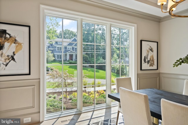 6952 Duncraig Ct, Mclean, VA 22101 - dining room featuring a chandelier, healthy amount of natural light, a decorative wall, and wainscoting