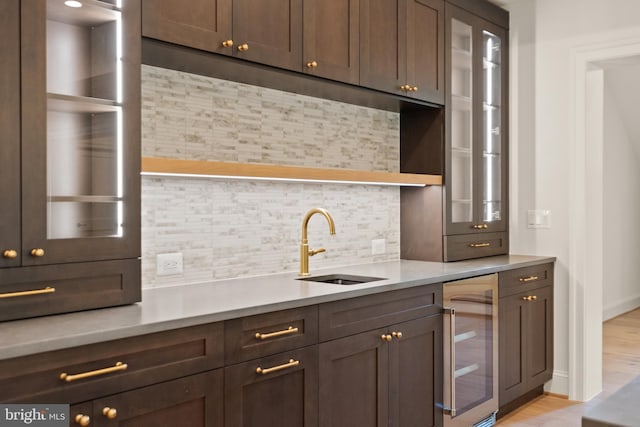 6952 Duncraig Ct, Mclean, VA 22101 - kitchen with wine cooler, tasteful backsplash, light countertops, and open shelves