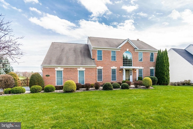 13225 Manor S, Mount Airy, MD 21771 - colonial inspired home featuring a front lawn, brick siding, and a shingled roof