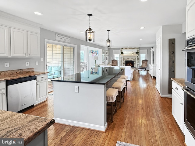 13225 Manor S, Mount Airy, MD 21771 - kitchen featuring appliances with stainless steel finishes, white cabinets, hardwood / wood-style floors, hanging light fixtures, and recessed lighting