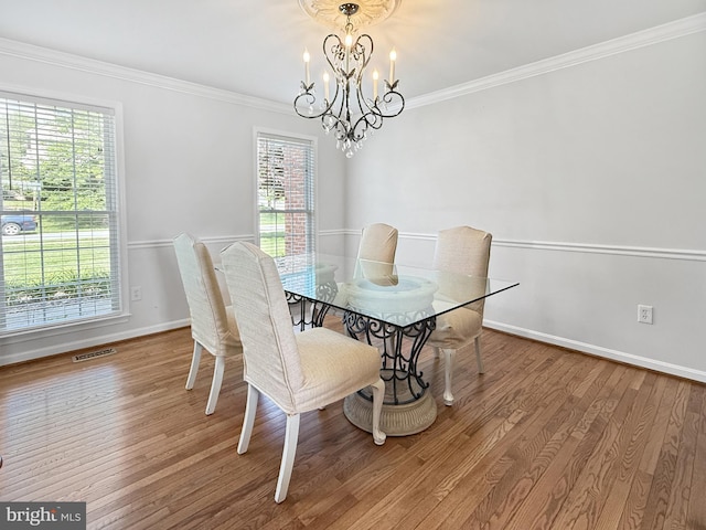 13225 Manor S, Mount Airy, MD 21771 - dining area featuring a chandelier, plenty of natural light, wood finished floors, baseboards, and crown molding