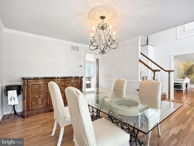 13225 Manor S, Mount Airy, MD 21771 - dining space with a chandelier, light wood-style floors, crown molding, and stairs