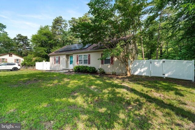 403 S Brynwood Dr, Browns Mills, NJ 08015 - view of front of house featuring a gate and roof mounted solar panels
