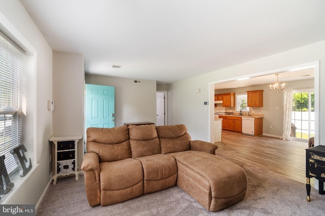 403 S Brynwood Dr, Browns Mills, NJ 08015 - living room featuring a chandelier, light colored carpet, and baseboards