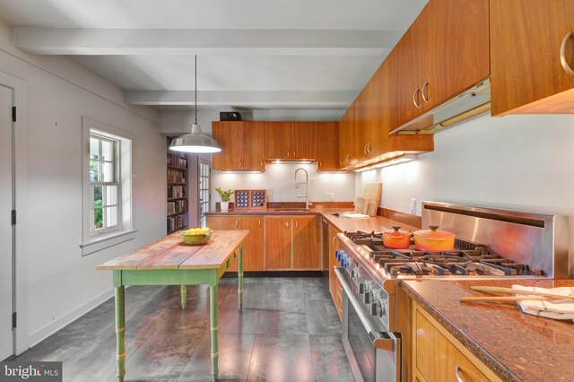 323 N Patrick St, Alexandria, VA 22314 - kitchen featuring high end stove, a sink, beam ceiling, brown cabinets, and under cabinet range hood