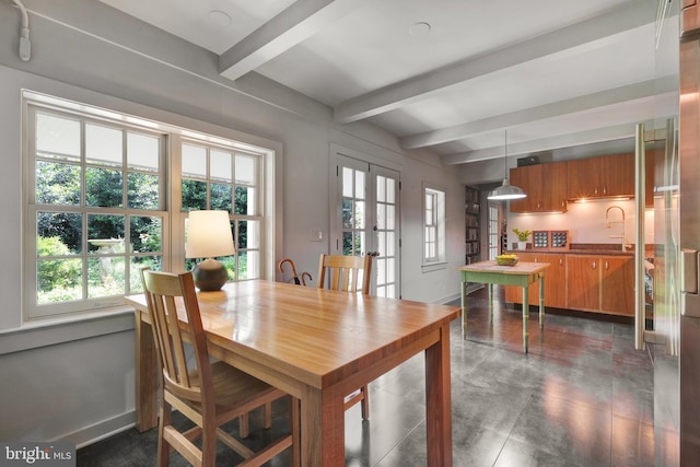 323 N Patrick St, Alexandria, VA 22314 - dining space with beam ceiling, baseboards, french doors, and finished concrete flooring