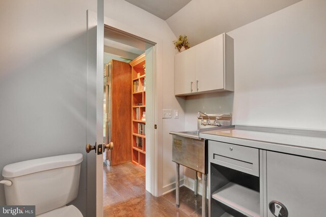 323 N Patrick St, Alexandria, VA 22314 - bathroom with toilet and vaulted ceiling