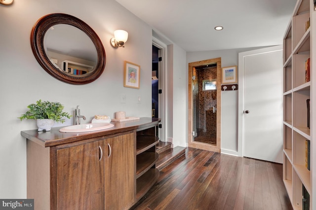 323 N Patrick St, Alexandria, VA 22314 - bathroom featuring a stall shower, wood-type flooring, recessed lighting, and vanity