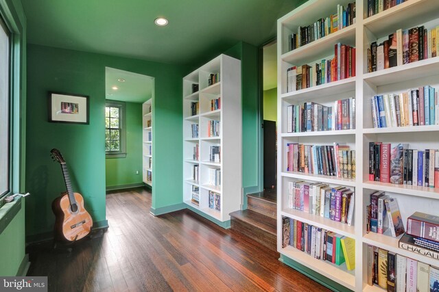323 N Patrick St, Alexandria, VA 22314 - living area with dark wood-style flooring, wall of books, baseboards, and recessed lighting