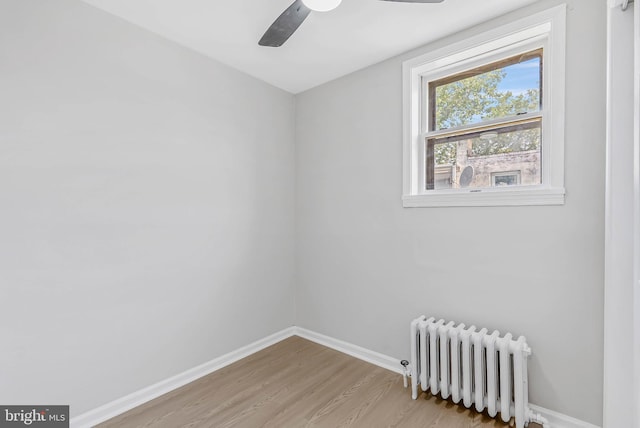 2839 Winton St, Philadelphia, PA 19145 - spare room with radiator, light wood-style flooring, baseboards, and ceiling fan