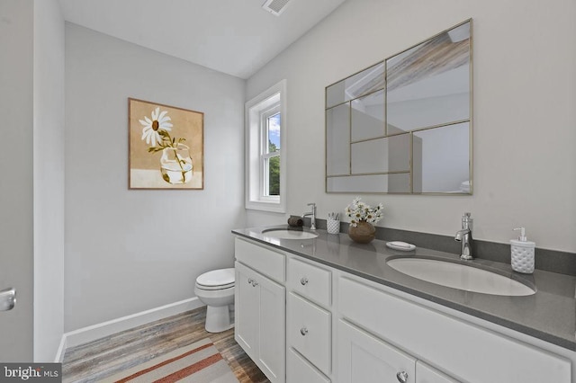 3376 Jefferson Pond Rd, Federalsburg, MD 21632 - full bathroom with toilet, double vanity, wood finished floors, baseboards, and a shower