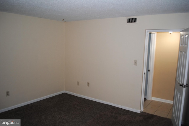 228 Canal Park Dr Unit G-1, Salisbury, MD 21804 - carpeted empty room with a textured ceiling and tile patterned flooring