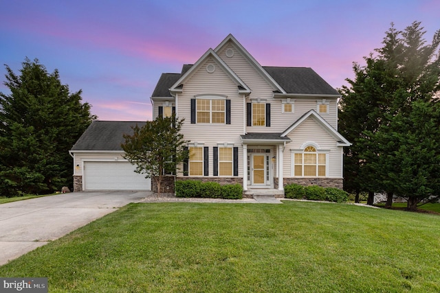 168 Joshua Dr, Hanover, PA 17331 - traditional-style home featuring stone siding, driveway, an attached garage, a front lawn, and a shingled roof