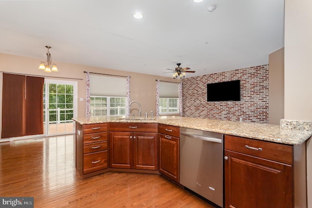 168 Joshua Dr, Hanover, PA 17331 - kitchen with dishwasher, light wood-type flooring, ceiling fan, a chandelier, and light stone counters