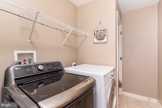 168 Joshua Dr, Hanover, PA 17331 - laundry room with washing machine and clothes dryer and light flooring