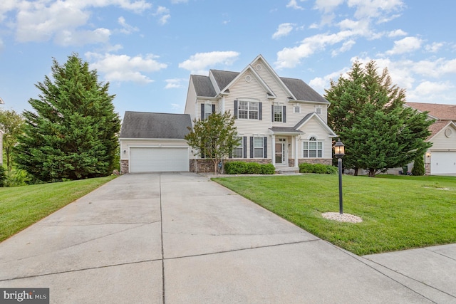 168 Joshua Dr, Hanover, PA 17331 - traditional-style house featuring stone siding, a garage, a front lawn, and driveway
