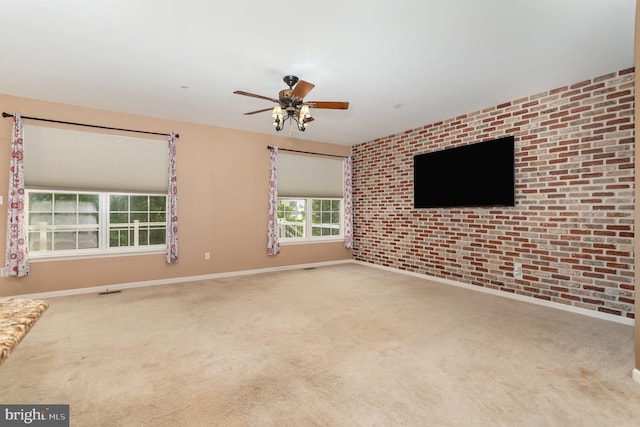 168 Joshua Dr, Hanover, PA 17331 - unfurnished living room featuring carpet floors, ceiling fan, and brick wall