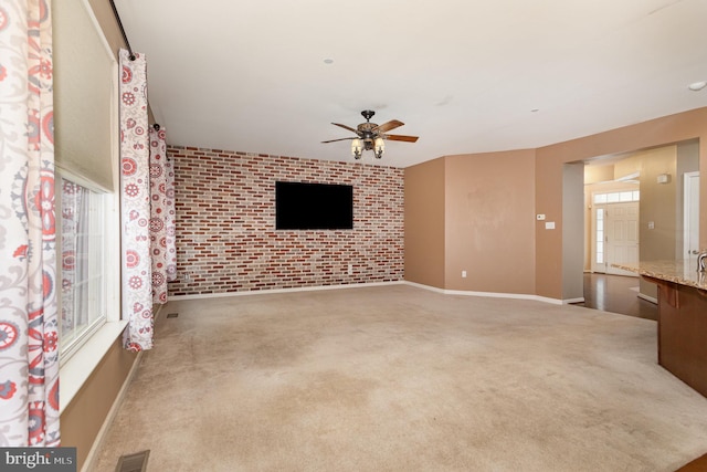 168 Joshua Dr, Hanover, PA 17331 - unfurnished living room featuring ceiling fan, carpet, and brick wall