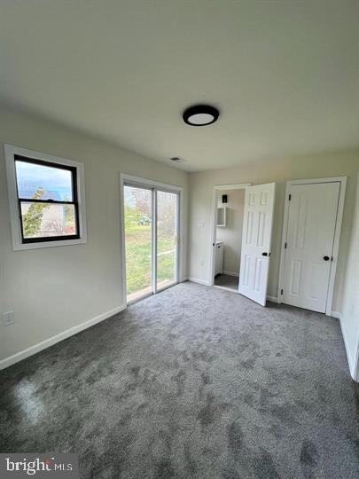 117 Idle Lake Rd, Franklinville, NJ 08322 - unfurnished bedroom with access to exterior, carpet flooring, and baseboards