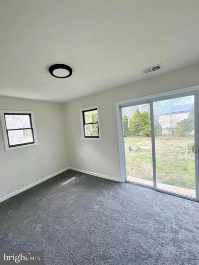 117 Idle Lake Rd, Franklinville, NJ 08322 - unfurnished room featuring dark colored carpet and baseboards