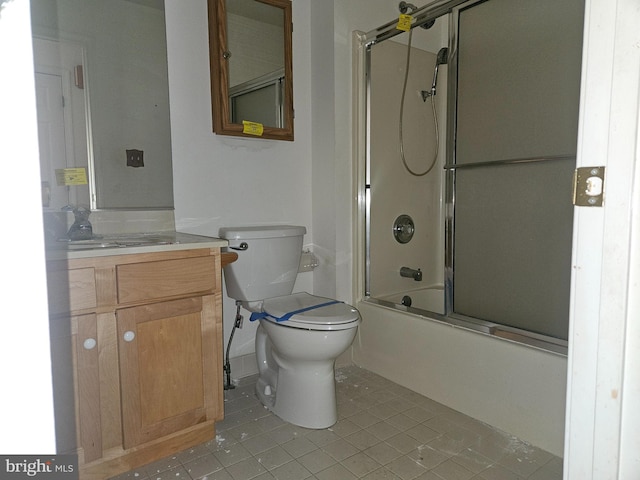 1139 Bradley Rd, Pasadena, MD 21122 - bathroom featuring tile patterned flooring, toilet, vanity, and combined bath / shower with glass door