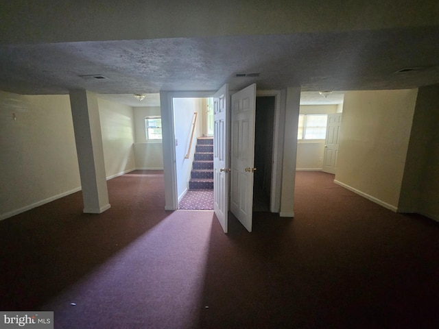 1139 Bradley Rd, Pasadena, MD 21122 - basement featuring carpet, baseboards, a textured ceiling, and stairway