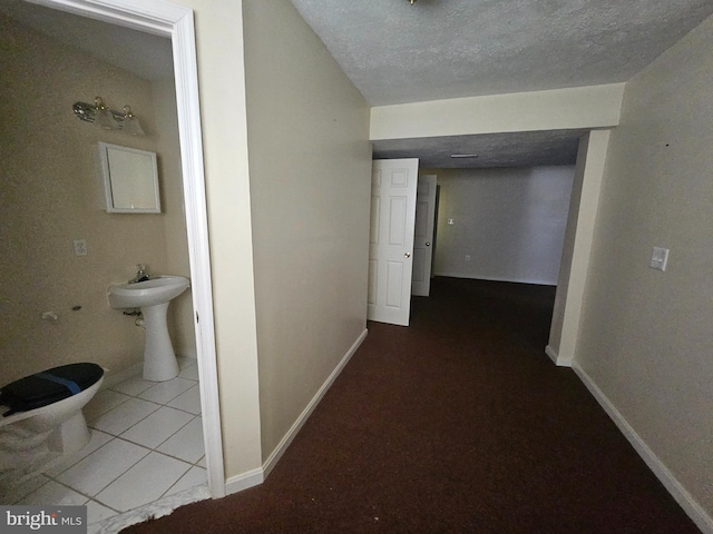 1139 Bradley Rd, Pasadena, MD 21122 - hall with baseboards and a textured ceiling