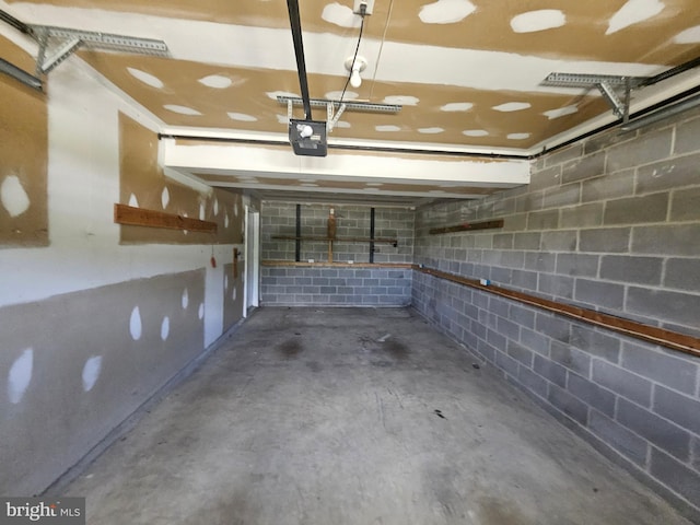 1139 Bradley Rd, Pasadena, MD 21122 - garage with a garage door opener and concrete block wall