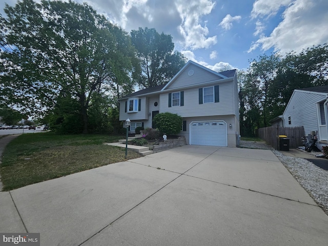 1139 Bradley Rd, Pasadena, MD 21122 - split foyer home with concrete driveway and a garage