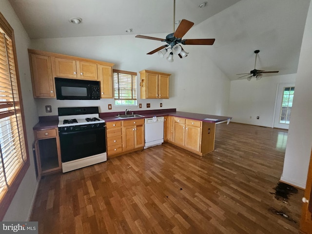 1139 Bradley Rd, Pasadena, MD 21122 - kitchen with black microwave, gas stove, dishwasher, a sink, and vaulted ceiling