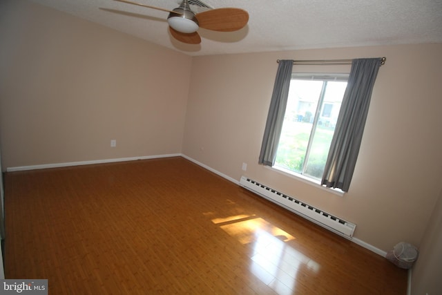 236 Vernon Rd, Monroe Township, NJ 08831 - unfurnished room with baseboard heating, ceiling fan, baseboards, and wood finished floors