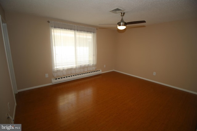 236 Vernon Rd, Monroe Township, NJ 08831 - unfurnished room featuring a baseboard radiator, a ceiling fan, baseboards, wood finished floors, and a textured ceiling