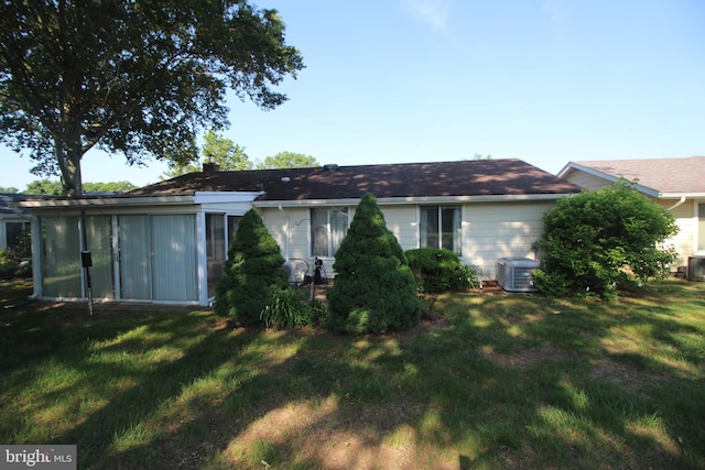 236 Vernon Rd, Monroe Township, NJ 08831 - back of property featuring a lawn and central AC unit