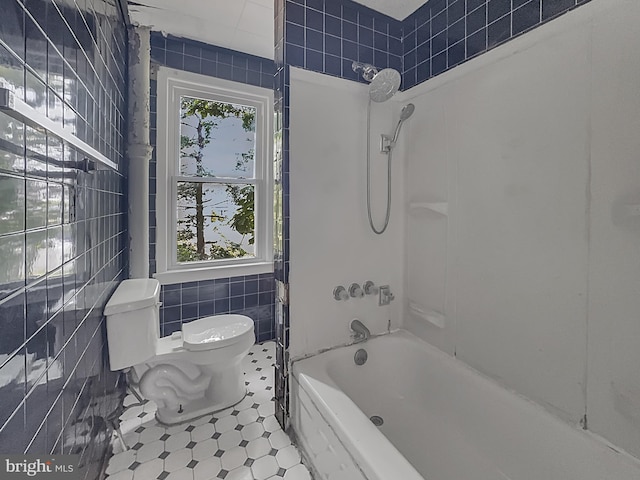123 W Foundry St, Millville, NJ 08332 - full bathroom featuring tile walls, toilet, tile patterned floors, and washtub / shower combination