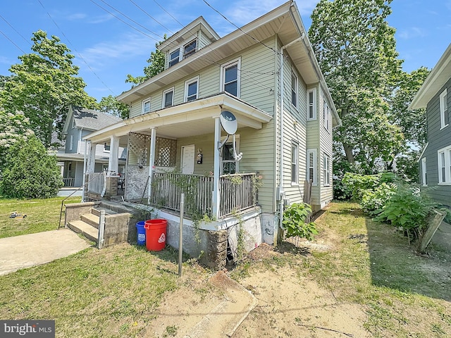 123 W Foundry St, Millville, NJ 08332 - american foursquare style home with covered porch and a front lawn