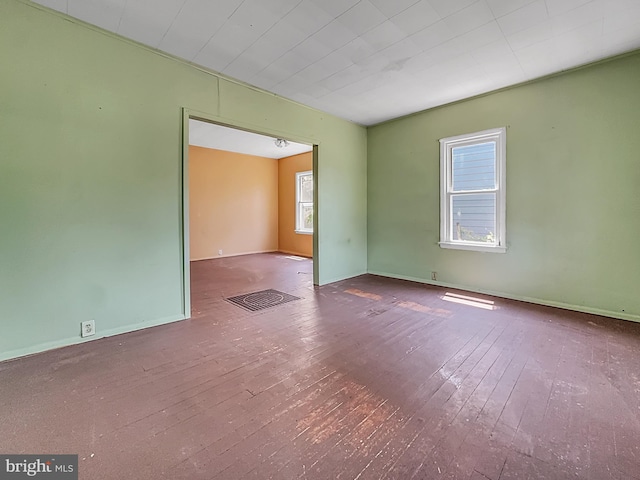 123 W Foundry St, Millville, NJ 08332 - spare room featuring plenty of natural light, wood-type flooring, and baseboards