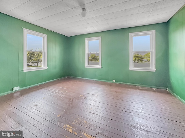 123 W Foundry St, Millville, NJ 08332 - spare room with hardwood / wood-style floors, plenty of natural light, and baseboards
