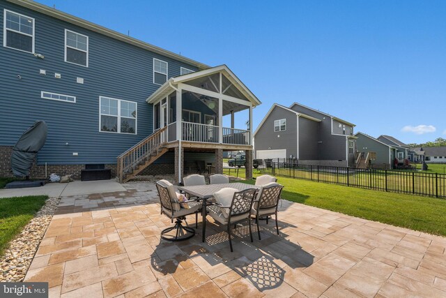 9400 Kinnerton Dr, Midlothian, VA 23112 - back of property featuring a sunroom, a patio area, outdoor dining area, and stairs