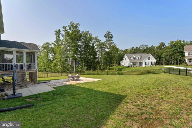 9400 Kinnerton Dr, Midlothian, VA 23112 - view of yard with a patio area, stairs, a sunroom, and view of wooded area