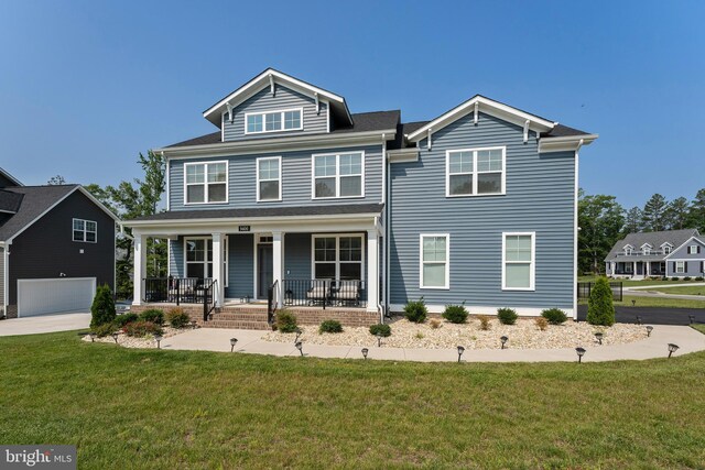 9400 Kinnerton Dr, Midlothian, VA 23112 - view of front of home with a porch, a front lawn, an attached garage, and driveway
