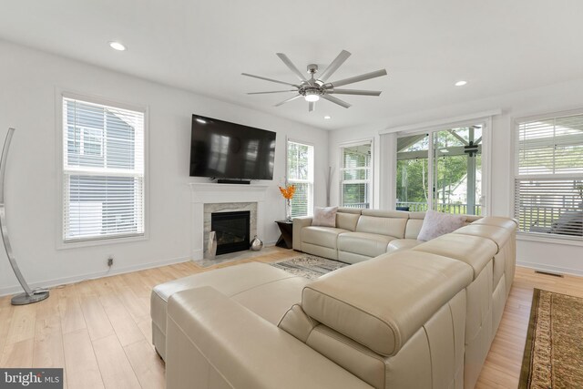 9400 Kinnerton Dr, Midlothian, VA 23112 - living room with a ceiling fan, light wood finished floors, a fireplace, baseboards, and recessed lighting