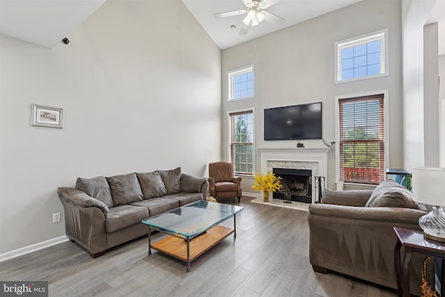127 Watch Hill Rd, East Fallowfield Township, PA 19320 - living room with high vaulted ceiling, a ceiling fan, a premium fireplace, and wood finished floors