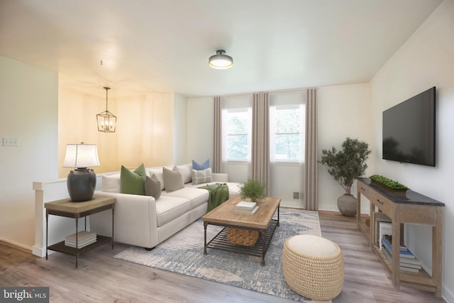 27136 Dogwood Ln, Mechanicsville, MD 20659 - living area featuring a chandelier, wood finished floors, and baseboards