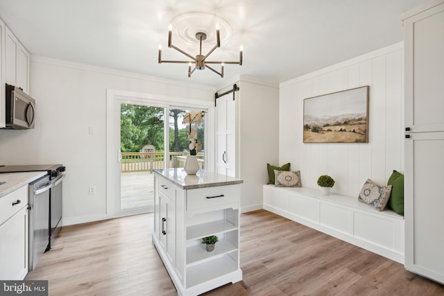 27136 Dogwood Ln, Mechanicsville, MD 20659 - kitchen featuring appliances with stainless steel finishes, a barn door, open shelves, and white cabinetry